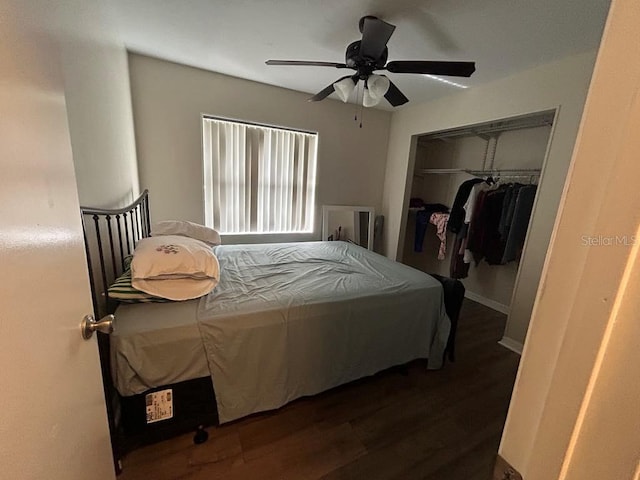 bedroom featuring ceiling fan, a closet, and wood finished floors