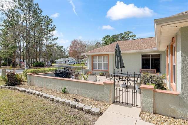 view of patio / terrace featuring fence