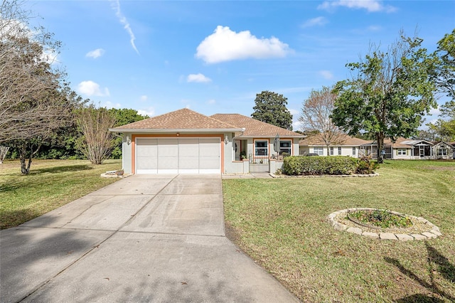 ranch-style home featuring a garage, concrete driveway, a front yard, and stucco siding