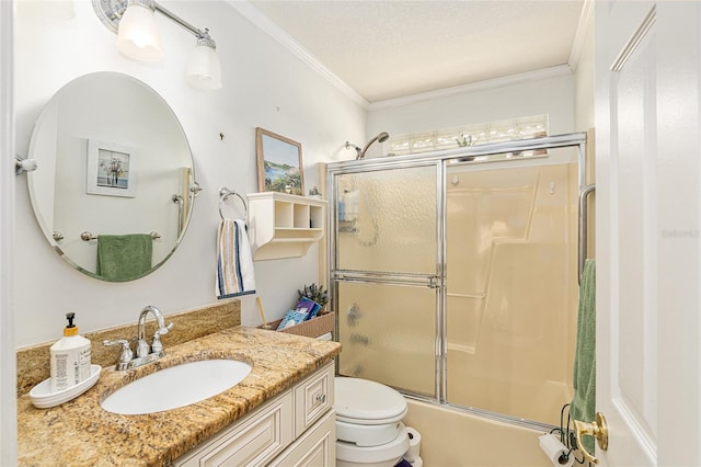 bathroom featuring toilet, ornamental molding, bath / shower combo with glass door, and vanity