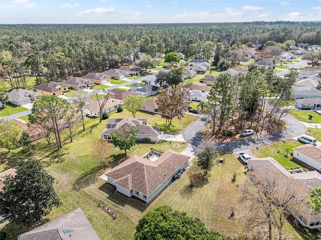 bird's eye view with a forest view and a residential view