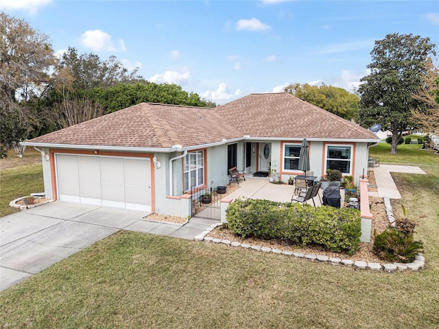 single story home with a garage, concrete driveway, a shingled roof, and a front lawn