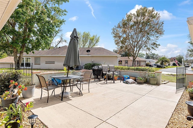 view of patio / terrace with outdoor dining area and fence