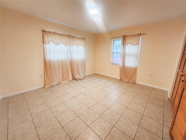 empty room featuring baseboards