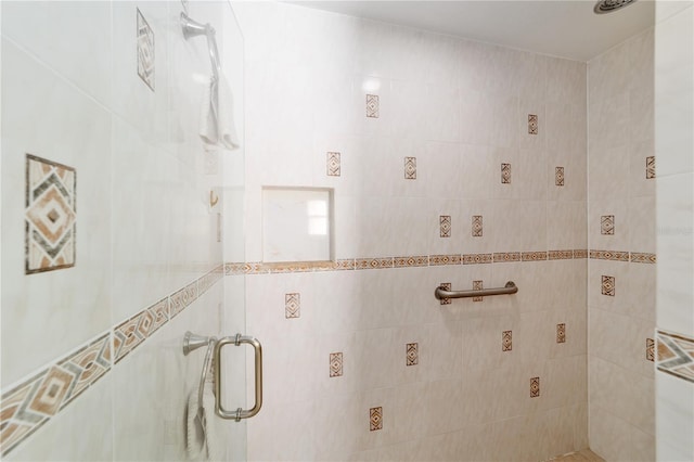 bathroom featuring a shower stall