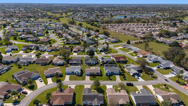 birds eye view of property with a residential view and a water view