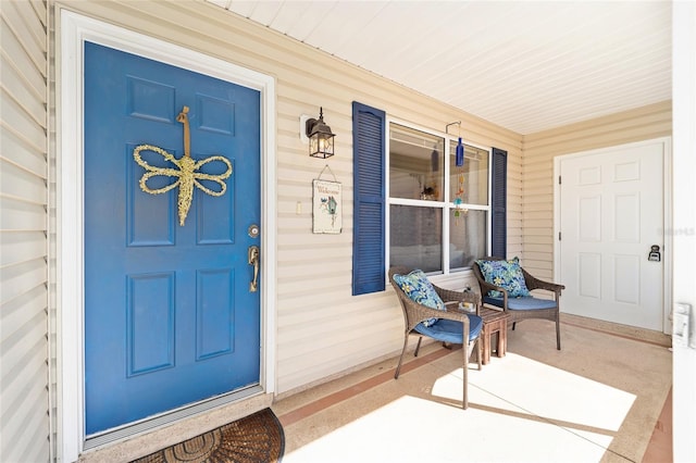 view of exterior entry featuring a porch