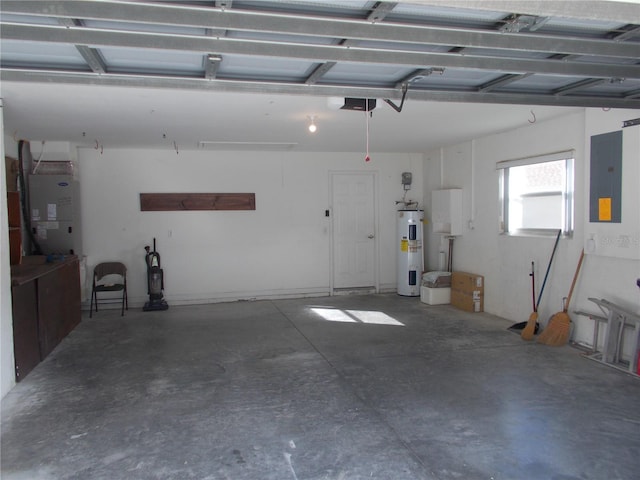 garage with a garage door opener, electric panel, and electric water heater