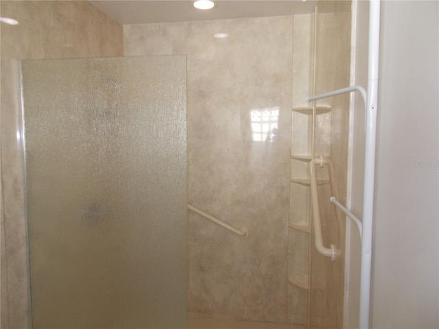 full bathroom featuring a stall shower and recessed lighting