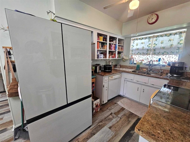 kitchen with a ceiling fan, white cabinets, a sink, wood finished floors, and dishwasher