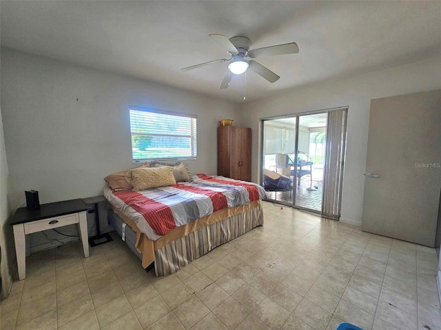 bedroom featuring access to outside and a ceiling fan