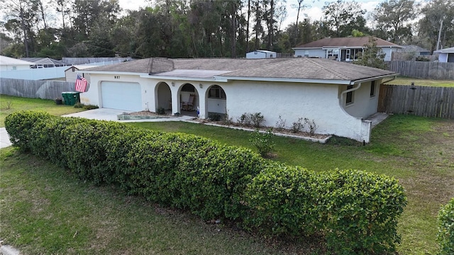 single story home with fence and a front lawn