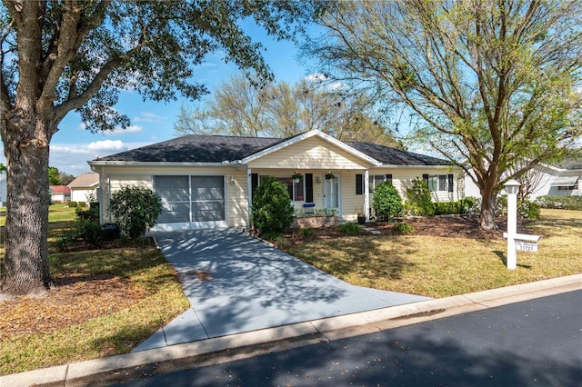 ranch-style house with an attached garage, covered porch, a front lawn, and concrete driveway