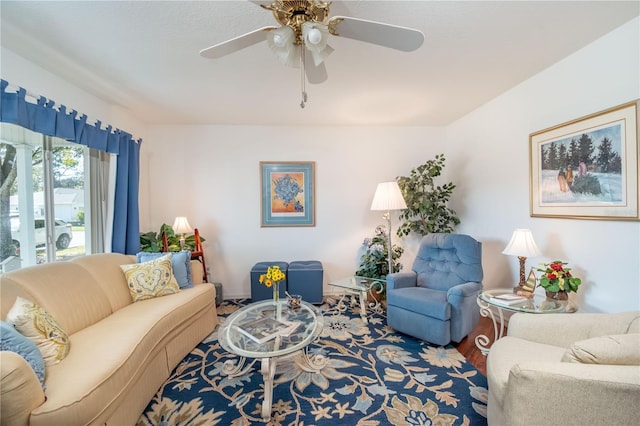 living room featuring a ceiling fan and wood finished floors