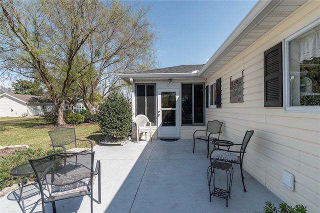 view of patio / terrace with a sunroom