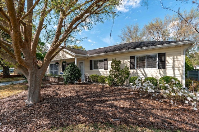 ranch-style home featuring cooling unit