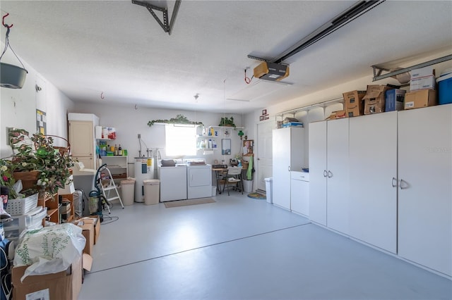 garage featuring a garage door opener and washing machine and clothes dryer