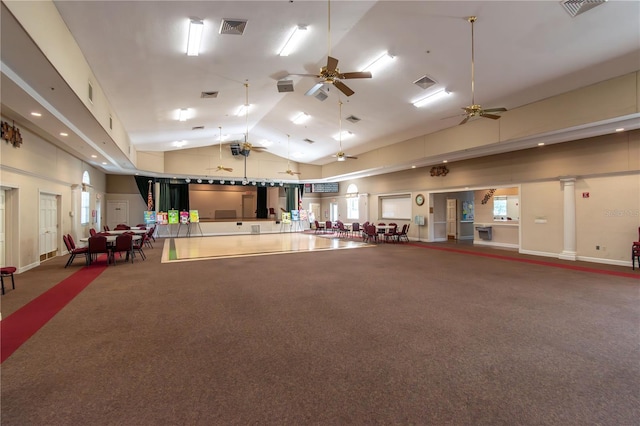 miscellaneous room featuring ornate columns, visible vents, and high vaulted ceiling