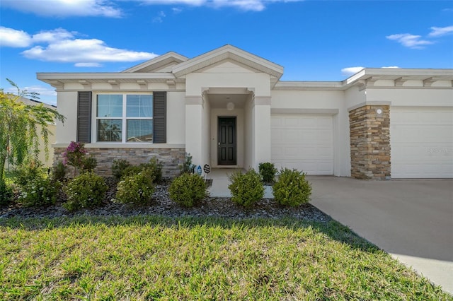 view of front of home with a garage, stone siding, and stucco siding