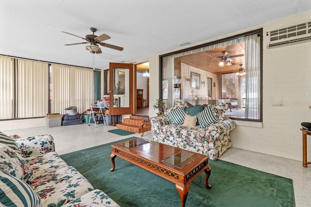 living room featuring visible vents, a wall mounted AC, and a ceiling fan