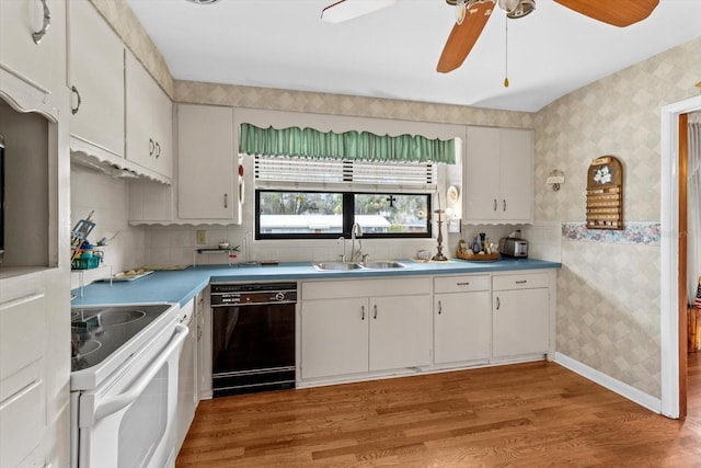 kitchen featuring wallpapered walls, light wood finished floors, dishwasher, white electric range, and a sink