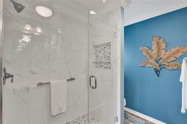 full bathroom with toilet, baseboards, crown molding, and a marble finish shower