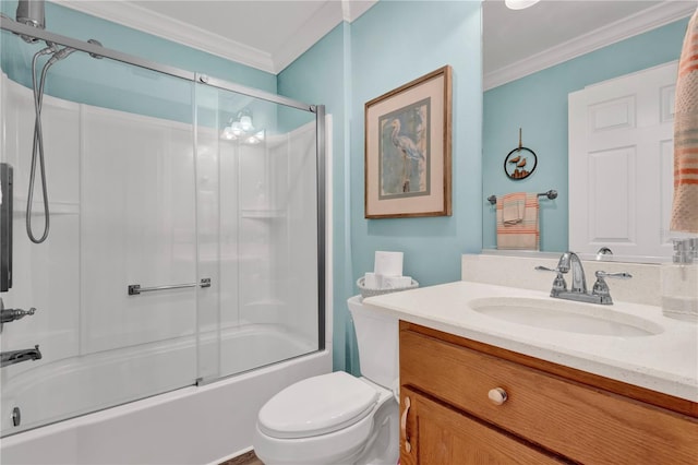 bathroom with combined bath / shower with glass door, crown molding, vanity, and toilet