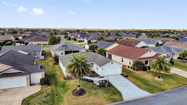 birds eye view of property with a residential view