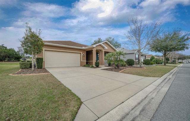 ranch-style house featuring a front lawn, driveway, an attached garage, and stucco siding