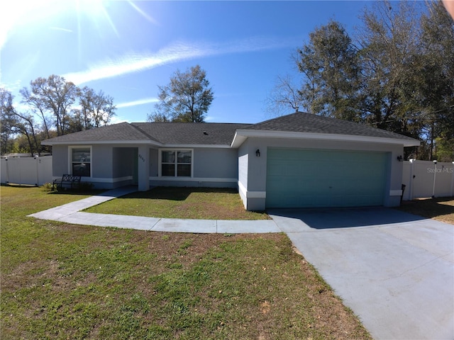 ranch-style house with stucco siding, an attached garage, a gate, fence, and a front yard