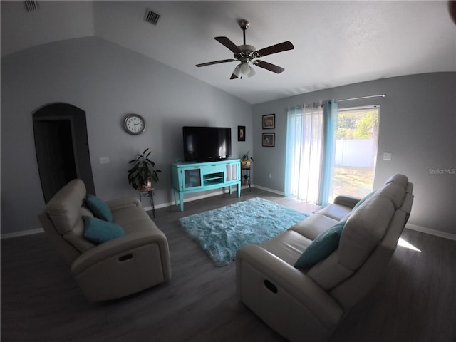 living room with visible vents, arched walkways, vaulted ceiling, and wood finished floors