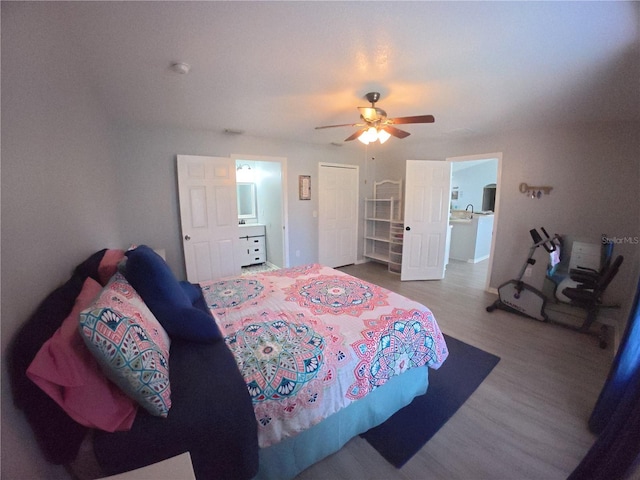 bedroom featuring ceiling fan and wood finished floors