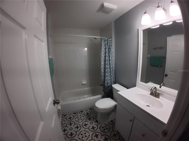 full bath with vanity, shower / bath combination with curtain, toilet, and tile patterned floors