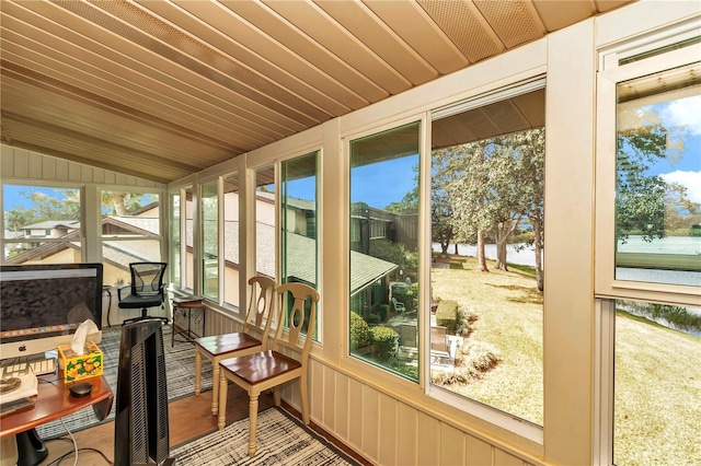 sunroom with vaulted ceiling, wooden ceiling, and a healthy amount of sunlight