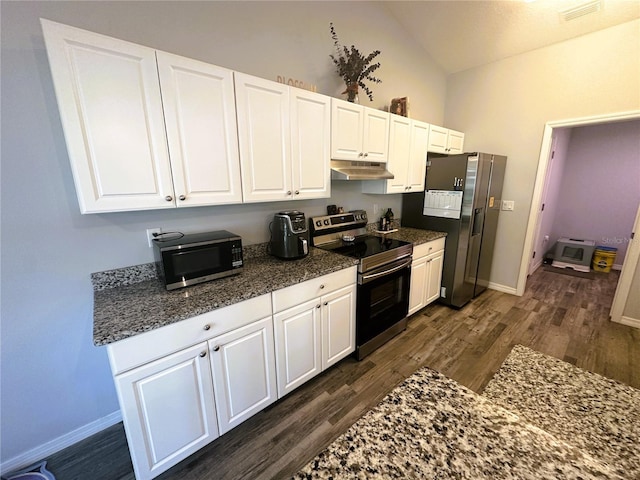 kitchen with under cabinet range hood, dark wood-style flooring, visible vents, white cabinets, and appliances with stainless steel finishes