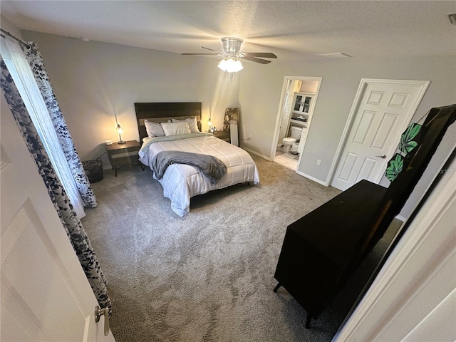 bedroom with baseboards, a ceiling fan, connected bathroom, a textured ceiling, and carpet floors