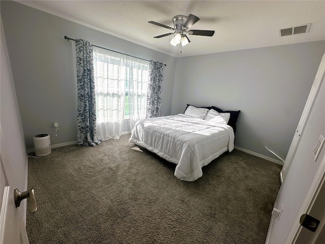 carpeted bedroom featuring visible vents, ceiling fan, a textured ceiling, and baseboards