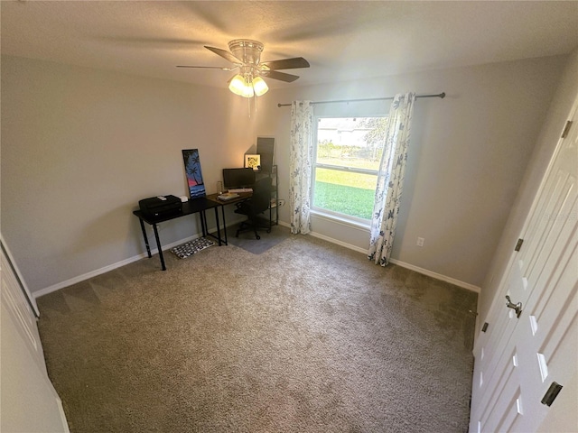 office space with a ceiling fan, carpet flooring, and baseboards