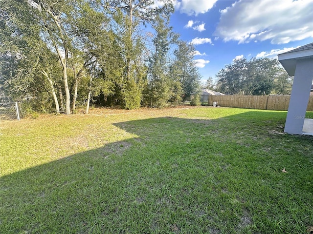 view of yard with fence