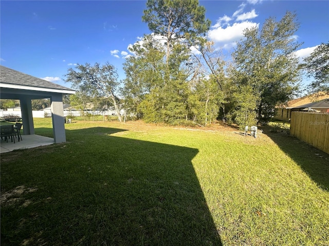 view of yard featuring a patio area and fence