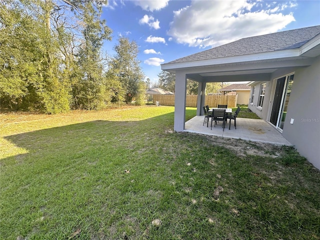 view of yard with a patio and fence