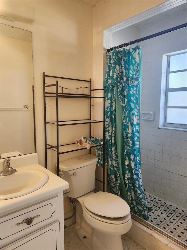 full bath with toilet, a shower stall, tile patterned flooring, and vanity