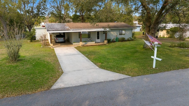 ranch-style home with a carport, concrete driveway, and a front lawn