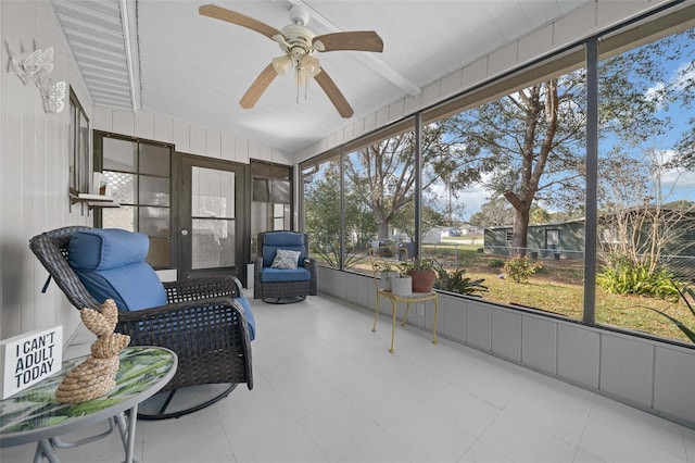 sunroom / solarium featuring ceiling fan