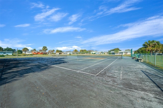 view of sport court with fence