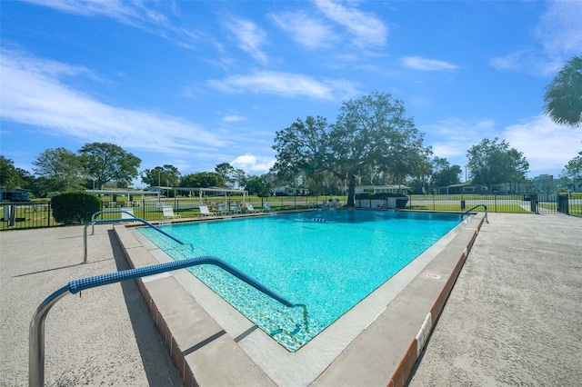 community pool featuring fence