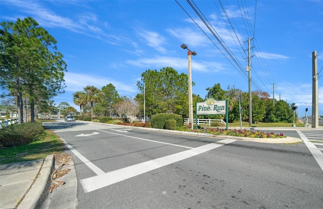 view of road with curbs