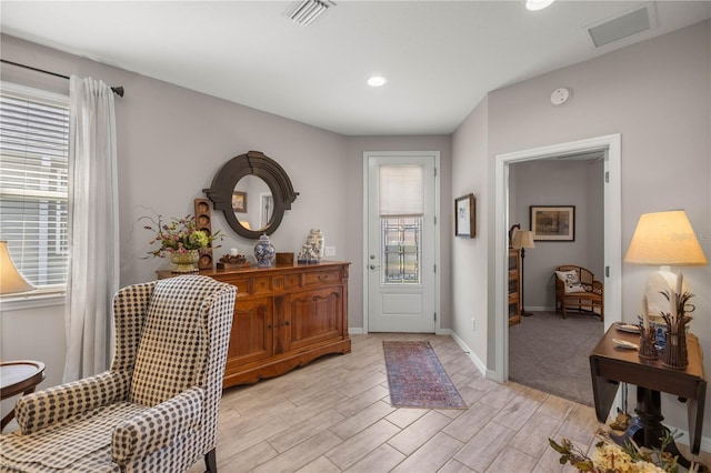 entryway with recessed lighting, light wood-type flooring, visible vents, and baseboards