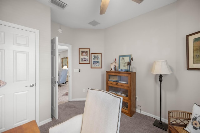 office featuring a ceiling fan, carpet flooring, visible vents, and baseboards