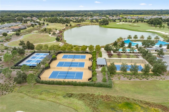 bird's eye view featuring view of golf course and a water view